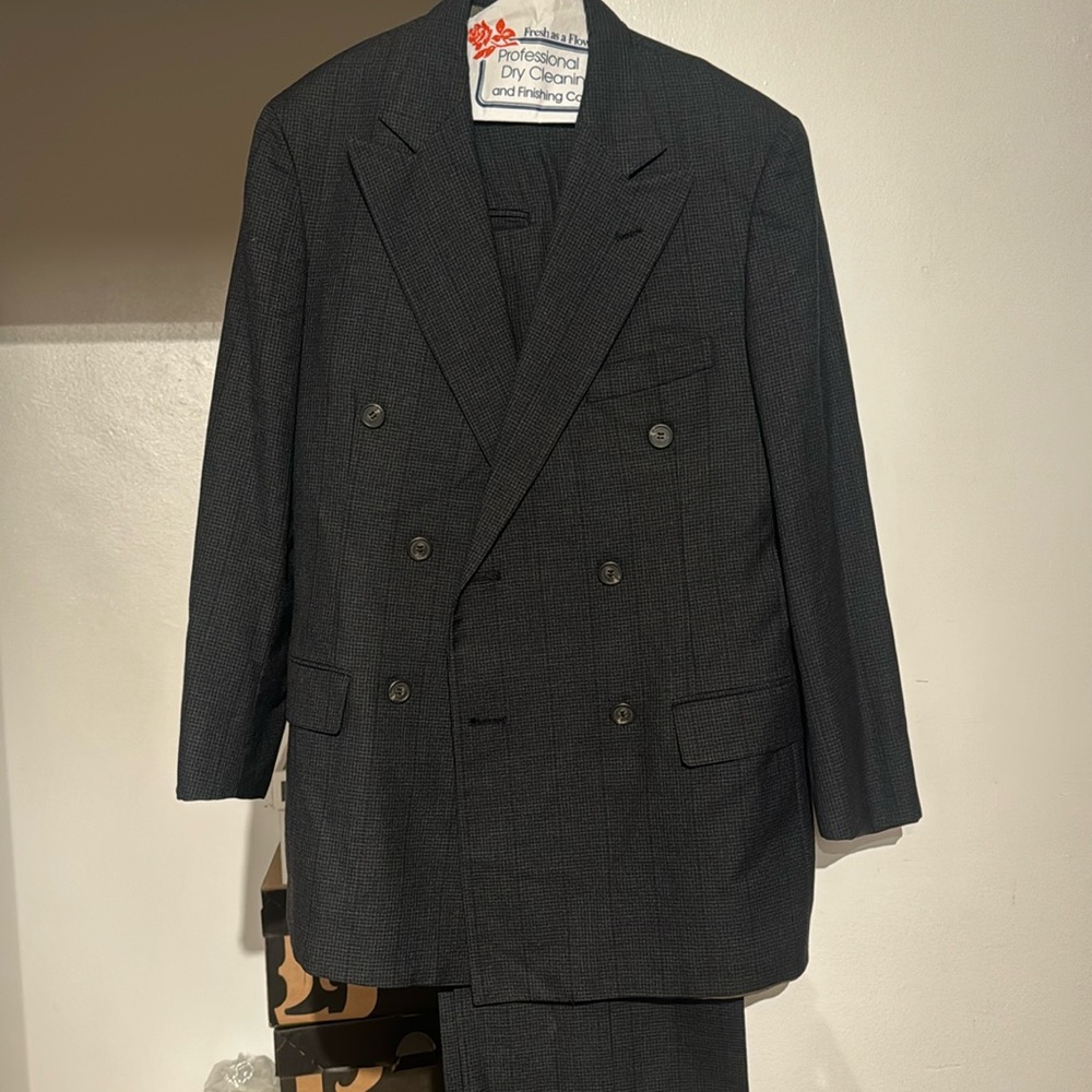 This is a charcoal grey and black men suit.